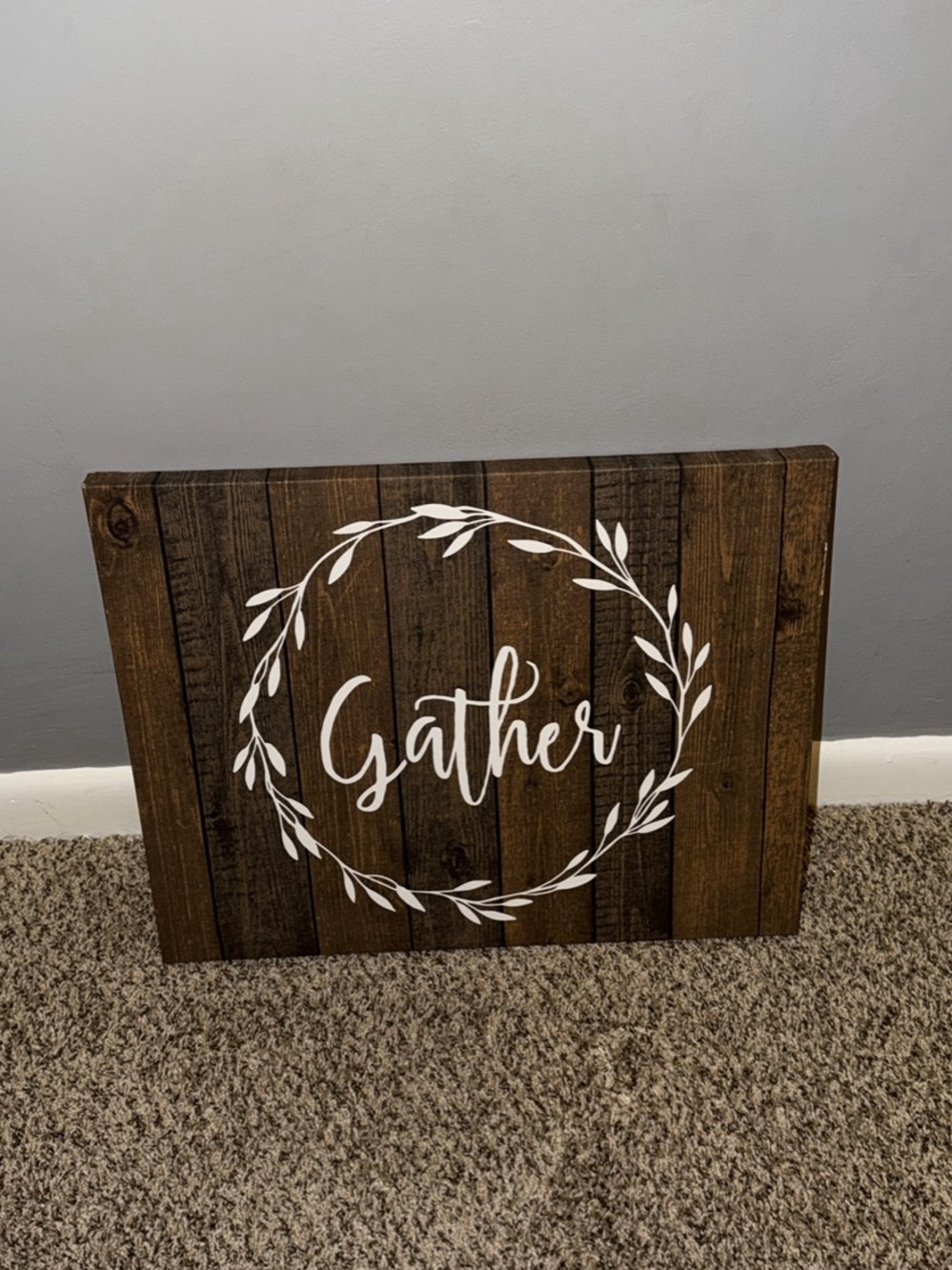 Gather Wooden Look Wall Decor Sign in Brown with White Wreath